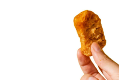Chicken Nugget Dipped In Sweet N Sour Sauce realistic fake food prop by FakeFood4U