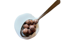 Spilled Cocoa Puffs With Milk On Spoon realistic fake food prop by FakeFood4U